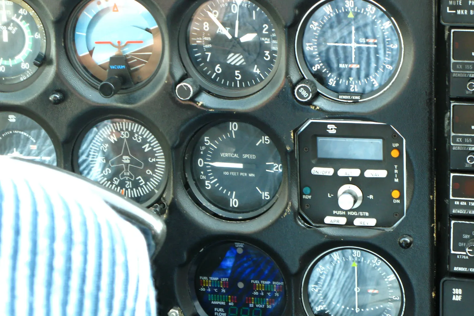 The instrument panel of a Cessna 172: airspeed indicator, attitude indicator, altimeter and other round dials.
