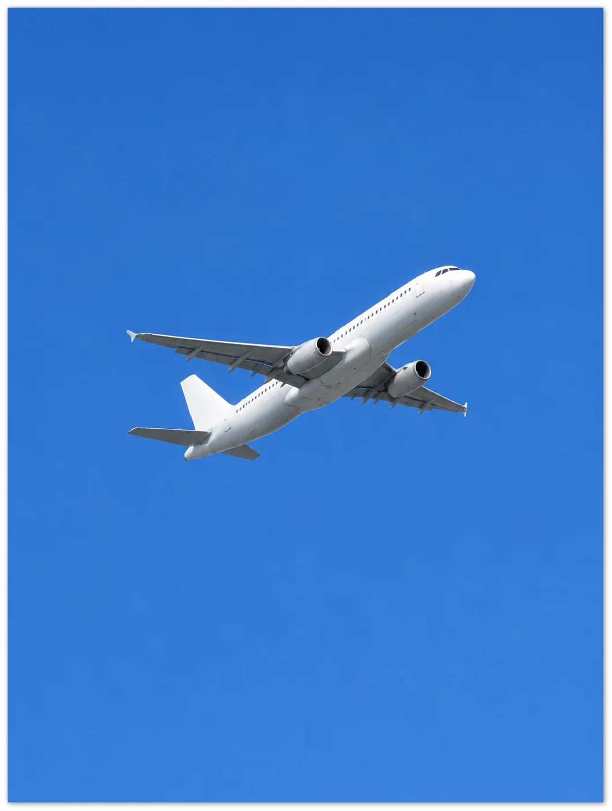 Example render of a frameless metal print: a plain white airliner climbing into a blue sky