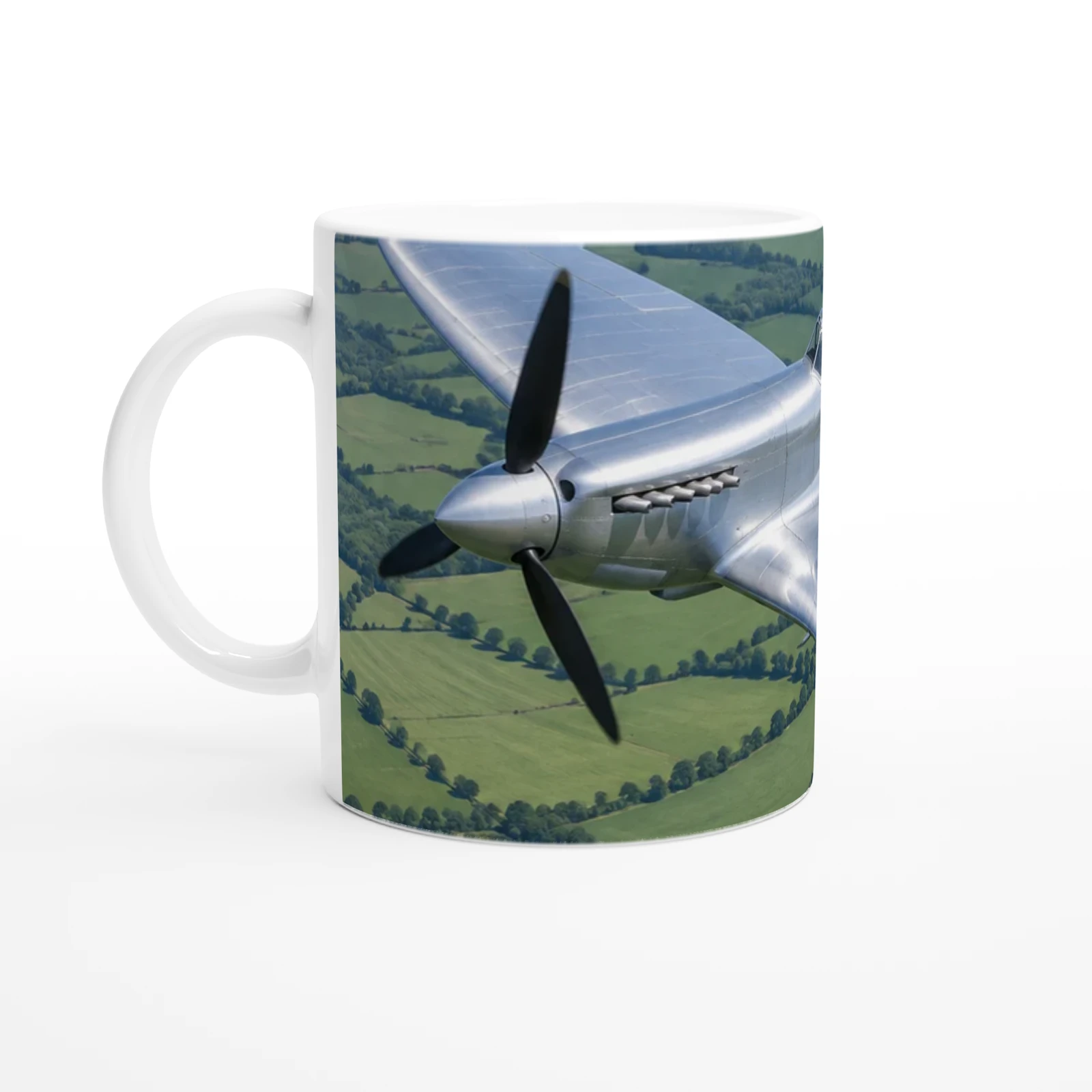 Example render of a white 11 oz ceramic mug, handle on the left: the nose of a silver 1940s fighter on the side you see